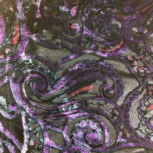 Child's blouse:  bright shiny purples, blacks